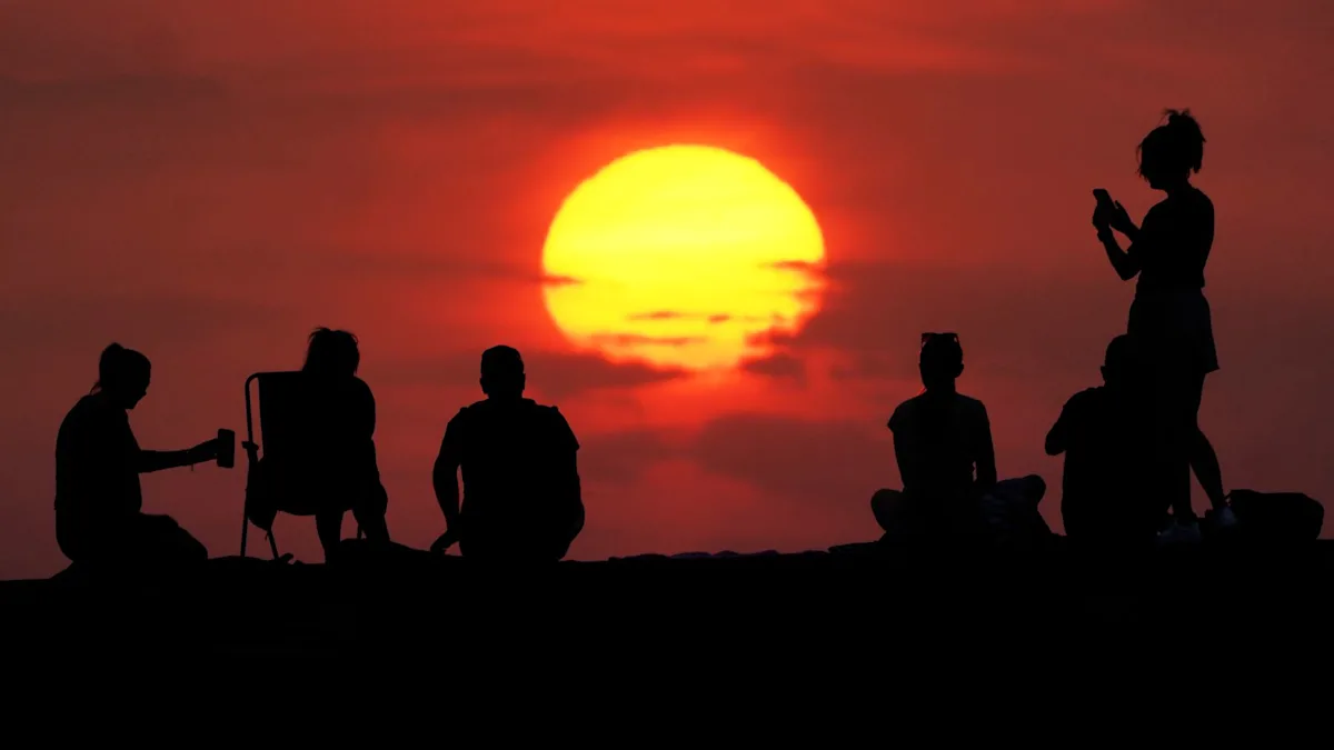 A descriptive image of a sunny day in the UK, with clear blue skies and warm temperatures, highlighting the primary keyword of UK heatwave, with people enjoying the sunshine in a park