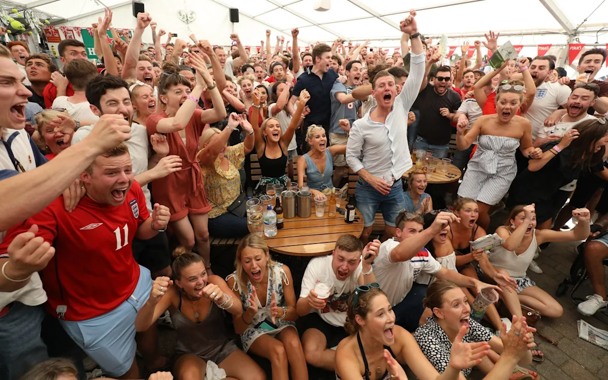 A bustling pub with customers watching a football match on a big screen, with a focus on the World Cup and the excitement of the tournament, highlighting the unique atmosphere and electric environment of pubs during major football events