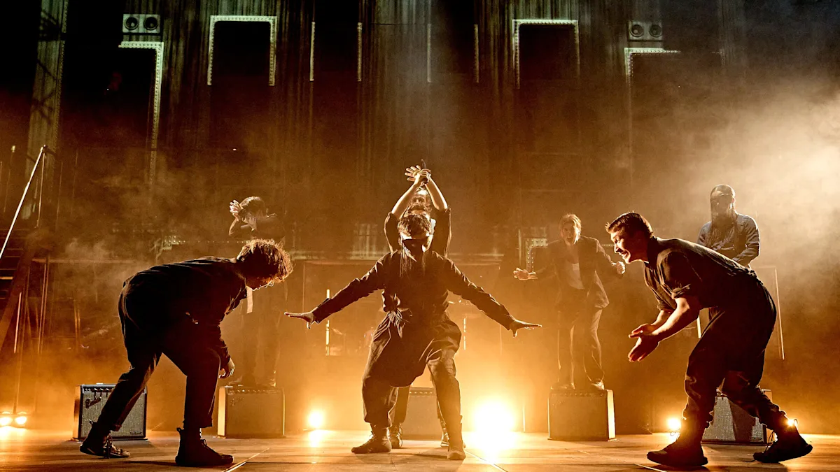 A dramatic image of the Barbican theatre, with a dark and moody backdrop, symbolising the themes of Radiohead's reworked Hamlet, a production that promises to be a haunting and thought-provoking experience, with a unique blend of soundscapes and stunning visuals, set to captivate London audiences