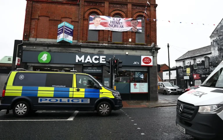 A group of police officers from diverse backgrounds standing together, symbolising diversity and inclusion in the force, with a subtle hint of controversy surrounding their spending habits