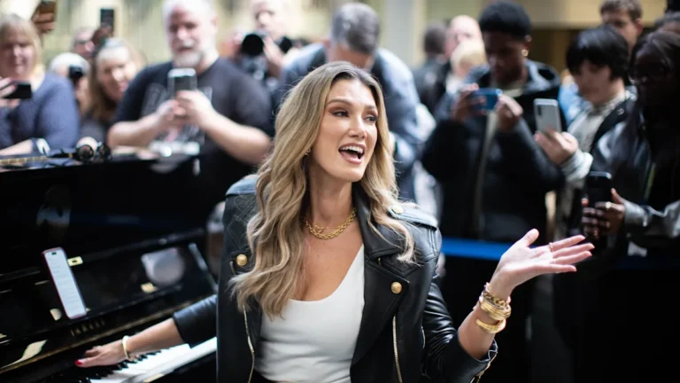 Delta Goodrem posing in a dancing outfit, with a beautiful smile and a confident attitude, ready to take the stage by storm on Strictly Come Dancing, with a touch of glamour and excitement
