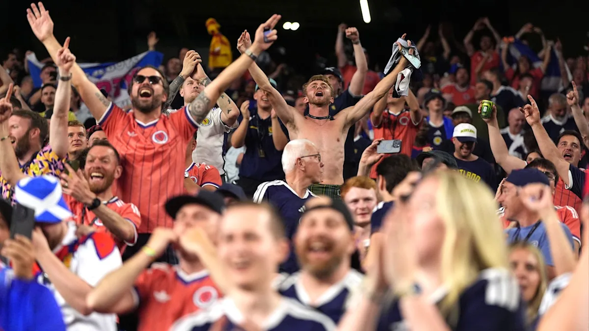 Scotland's football team celebrating their historic World Cup victory with fans, marking a significant milestone in the country's sporting history with a memorable and iconic moment in the world of football, as they claim their first World Cup win in 28 years