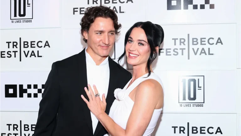 Katy Perry and Justin Trudeau walking the red carpet at the Tribeca Film Festival, looking stylish and supportive of the new documentary about music and social issues, with a colourful backdrop and flashing cameras
