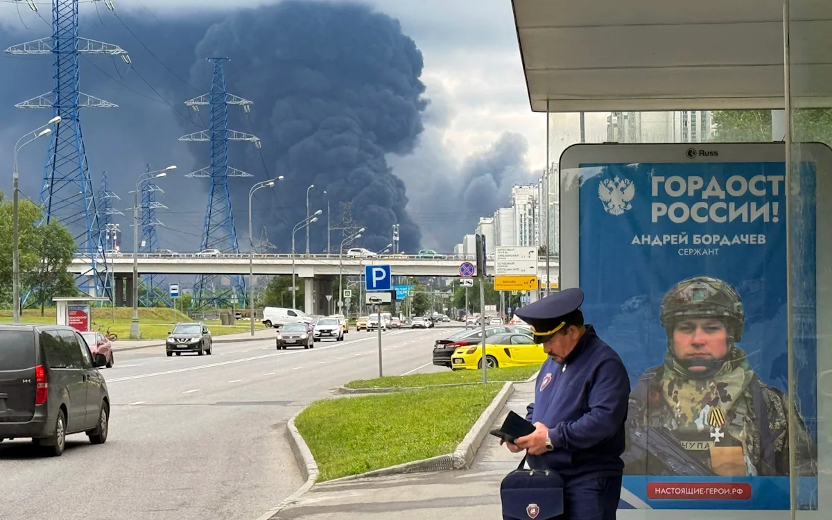 Aerial view of Moscow oil refinery, damaged by Ukraine's largest attack in two years, with smoke billowing from the facility, highlighting the severity of the conflict between Ukraine and Russia, and the potential consequences for the global energy market