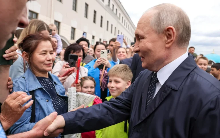 A crowd of people gathered around Putin, with some members revealed to be 'extras' hired to attend the event, highlighting the potential for manipulation in political behaviour and the importance of critical thinking