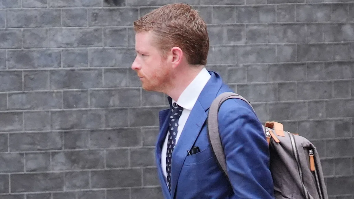 Met Police officers reviewing CCTV footage of Morgan McSweeney's phone theft, with a focus on investigation and community safety, in the heart of London, with a keen eye for detail