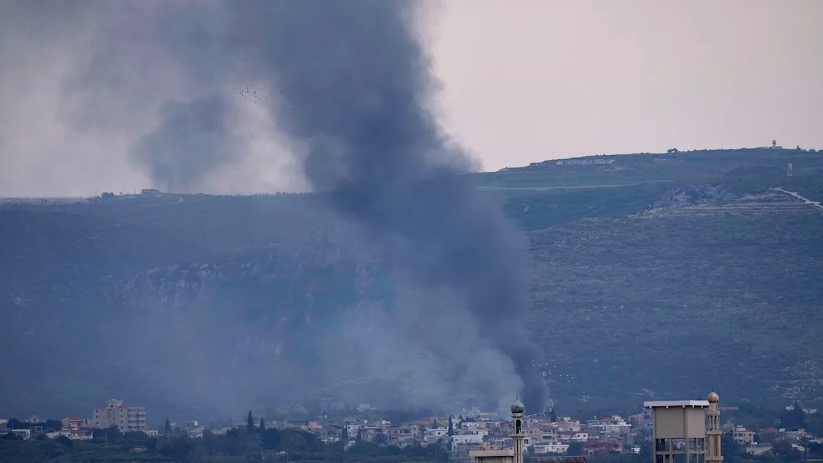 A large group of US troops arriving in the Middle East, with military equipment and vehicles in the background, as Iran warns against a ground invasion, highlighting the escalating Iran US tensions in the region