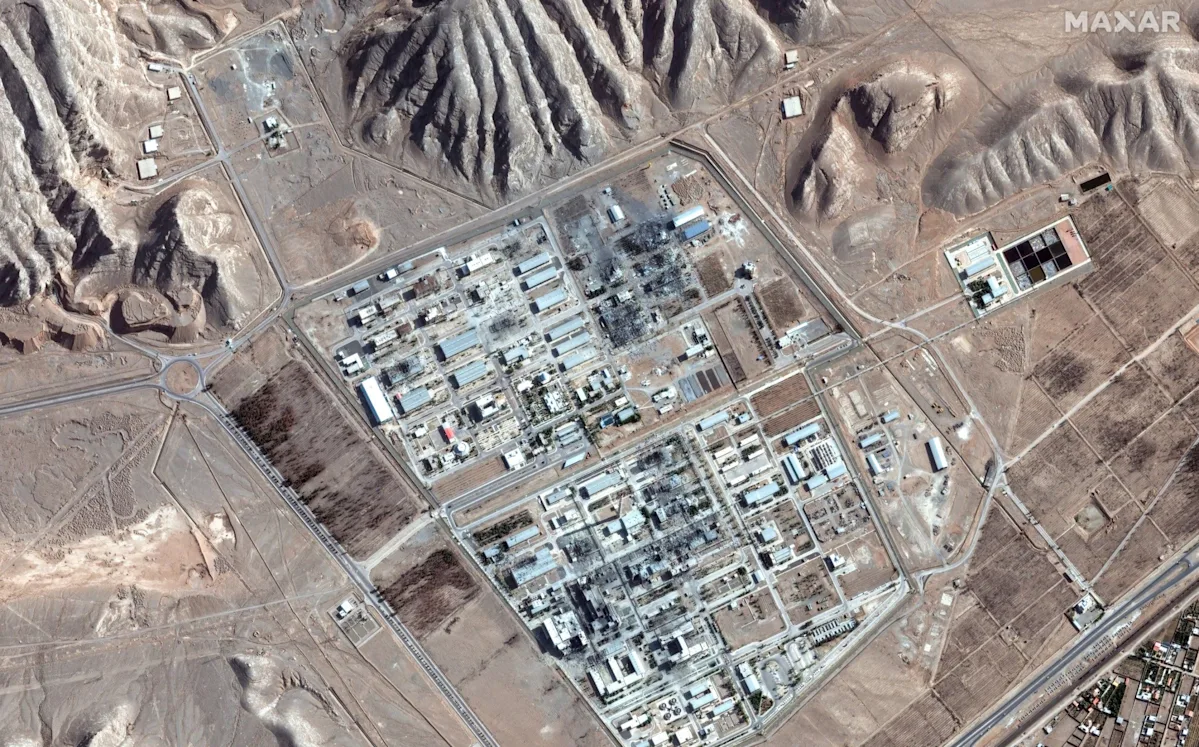 A group of soldiers in uniform, standing together with a bold and determined expression, ready to embark on a nuclear commando mission, with a subtle background of a war-torn landscape, symbolising the primary keyword of nuclear commando mission