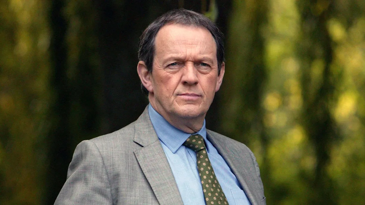 Kevin Whately and his wife on set, showcasing their on-screen chemistry and off-screen love, a perfect blend of talent and romance in the entertainment industry